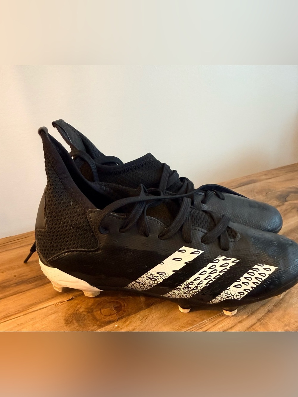 adidas Kids Black Soccer Cleats with White Graphic Stripes